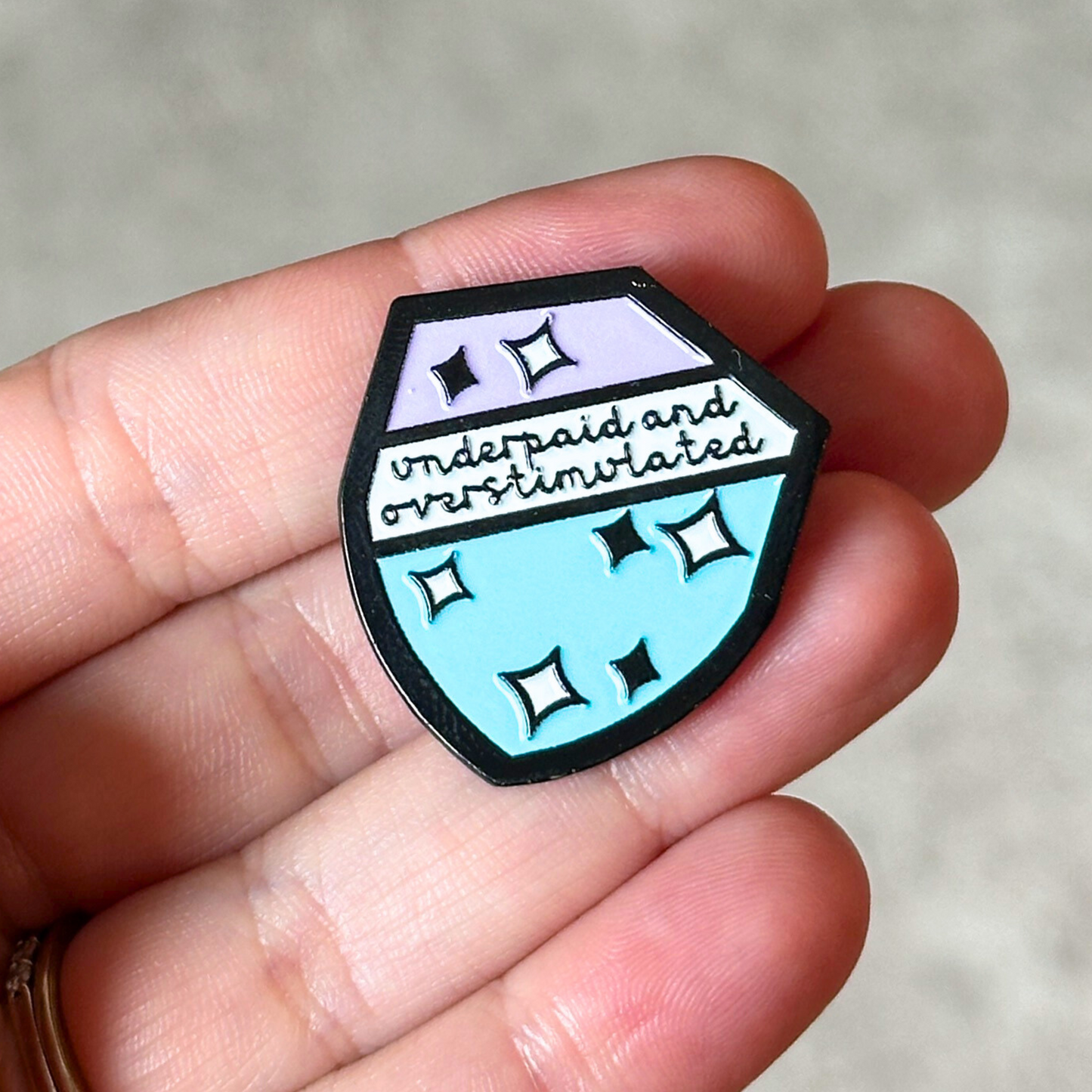 Underpaid and Overstimulated Enamel Pin